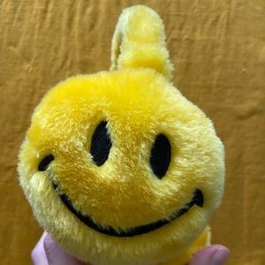 Yellow smiley face earmuffs